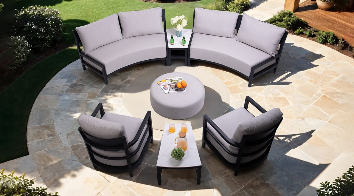 Bellmore 7-Piece Outdoor Conversation Set featuring Modern Curved Sofa, Club Chairs, Sintered Stone Side Table and Ottoman, Weather-Resistant Sunbrella Cushions - Life Outside