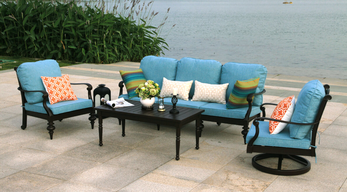 Elegant Cambridge Living Banner featuring a Spacious 3-Seat Sofa and Ergonomic Motion Chairs with Sunbrella Fabric Cushions on Cast Aluminum Frames - Life Outside